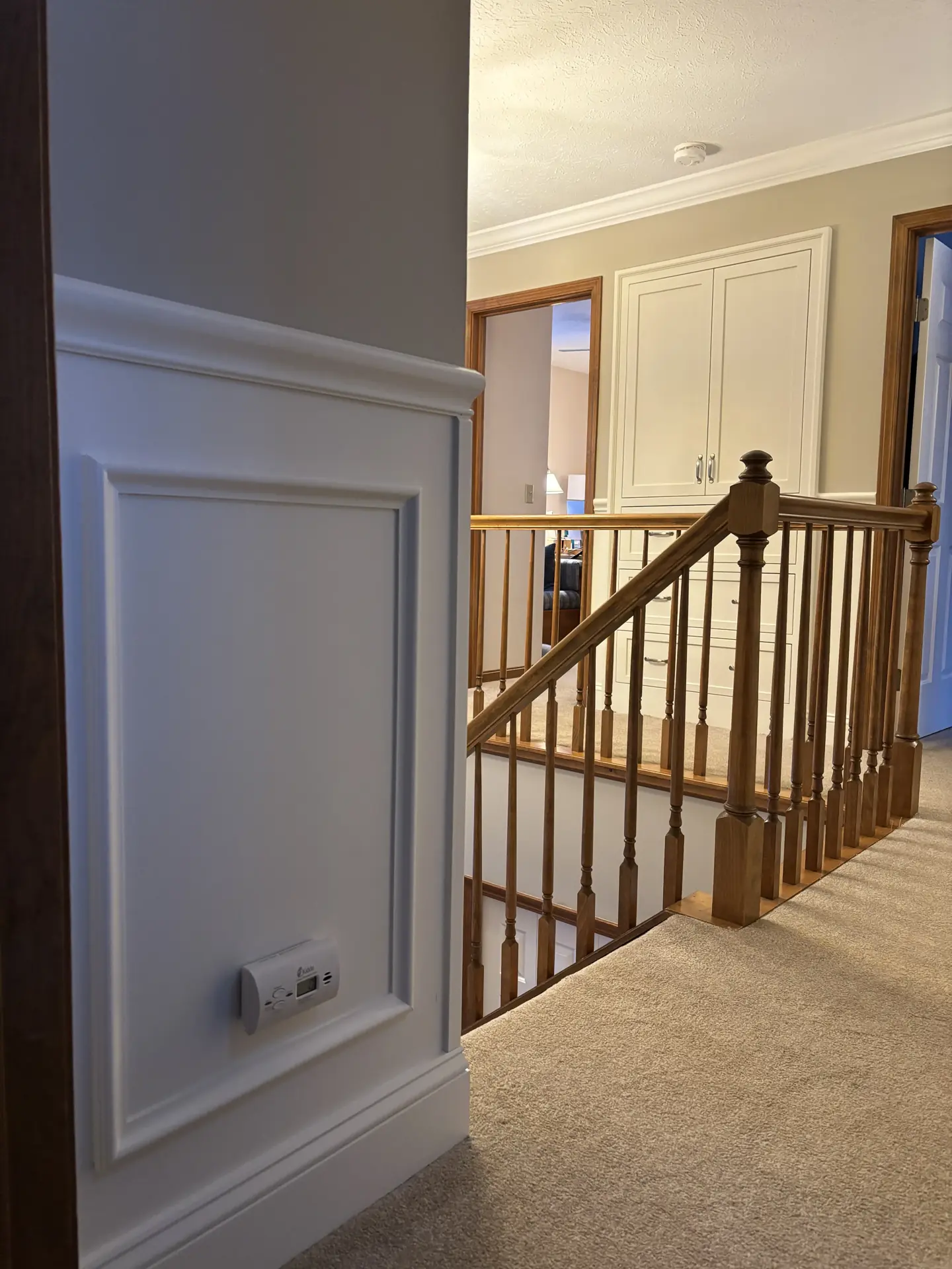 Upper landing railing and wainscoting